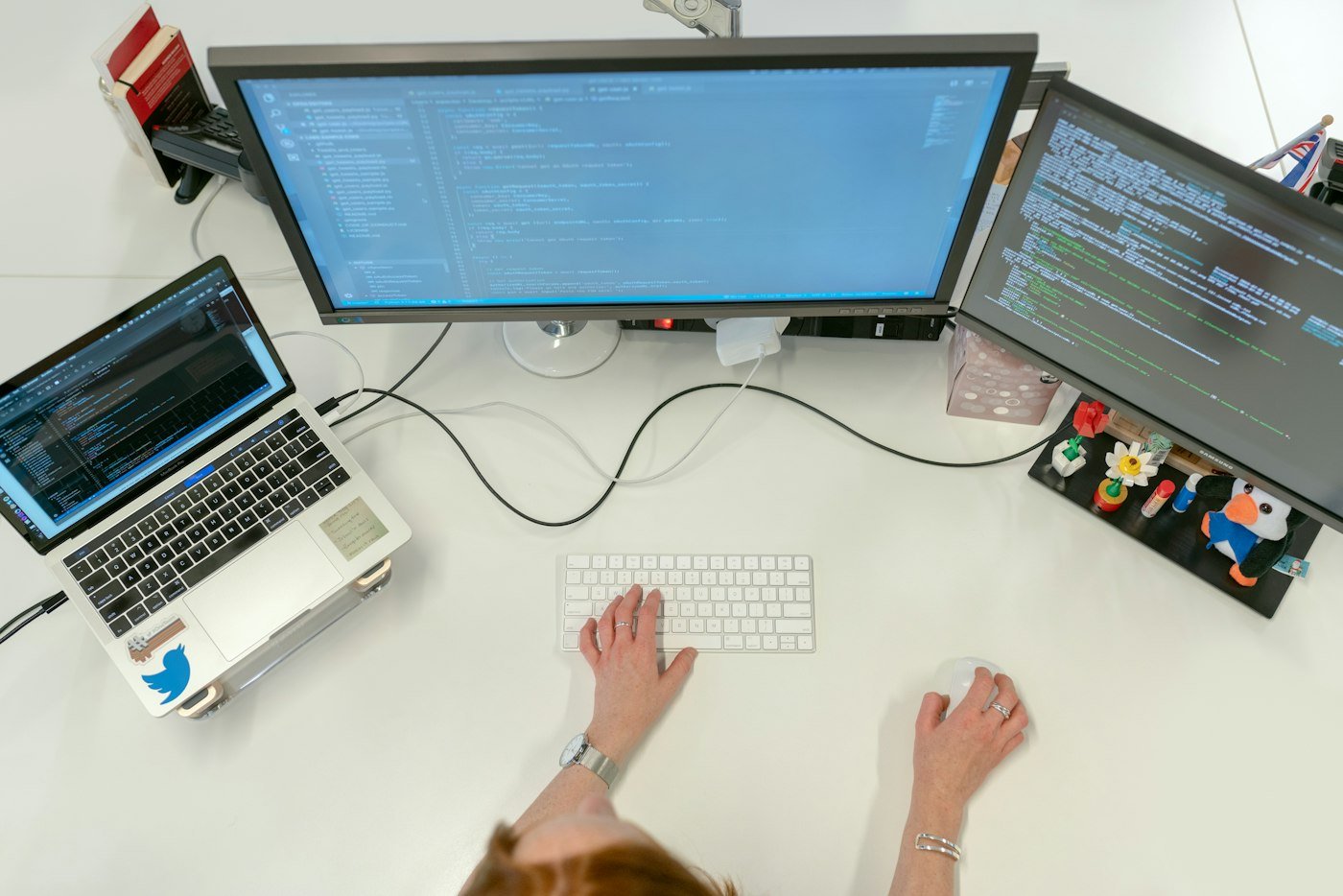 Developer workstation with laptop and monitors